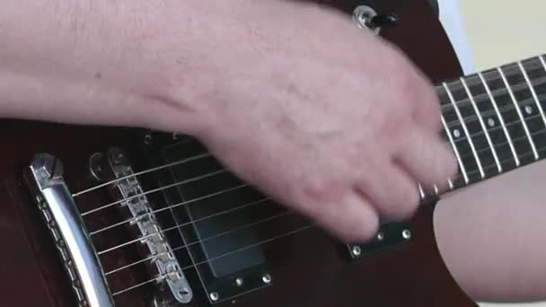 Guitarists hands playing song on electric guitar — Stock Video