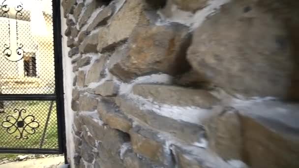 Vintage old style aged cracked stone wall hidef slow motion — Stock Video