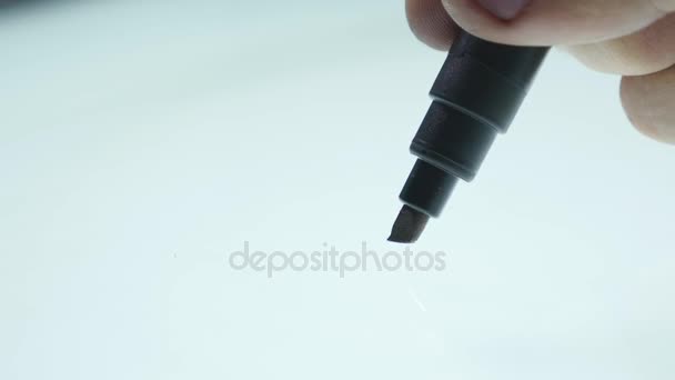 Male hand with marker writes on the board close up. white background — Stock Video