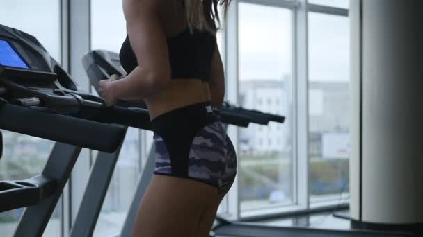 Woman running on treadmill. slow motion — Stock Video