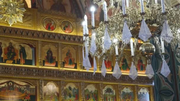 Dolly shot of a beautiful chandelier in church — Stock Video