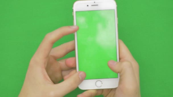 Using smart phone on green screen with various hand gestures, vertikal, close up - green screen — Stock Video