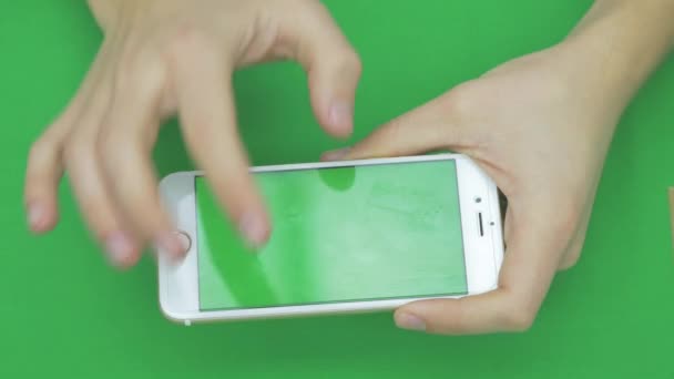 Using smart phone on green screen with various hand gestures, horizontally , close up - green screen — Stock Video