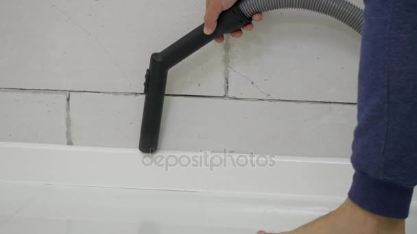 Portrait of happy, young man cleaning, hoovering his new home. close up — Stock Video