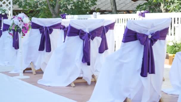 Dolly of rows of chairs at a wedding ceremony — Stock Video