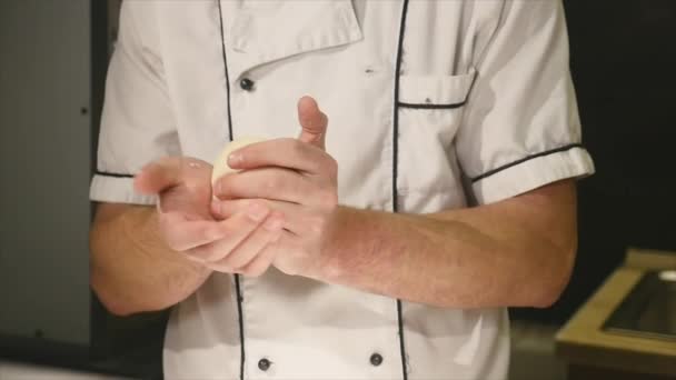 Man chef kneads the dough. — Stock Video