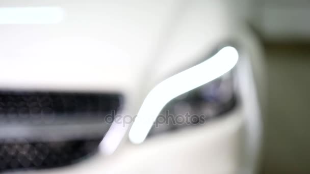 Close-up of a cars headlights. selective focus — Stock Video