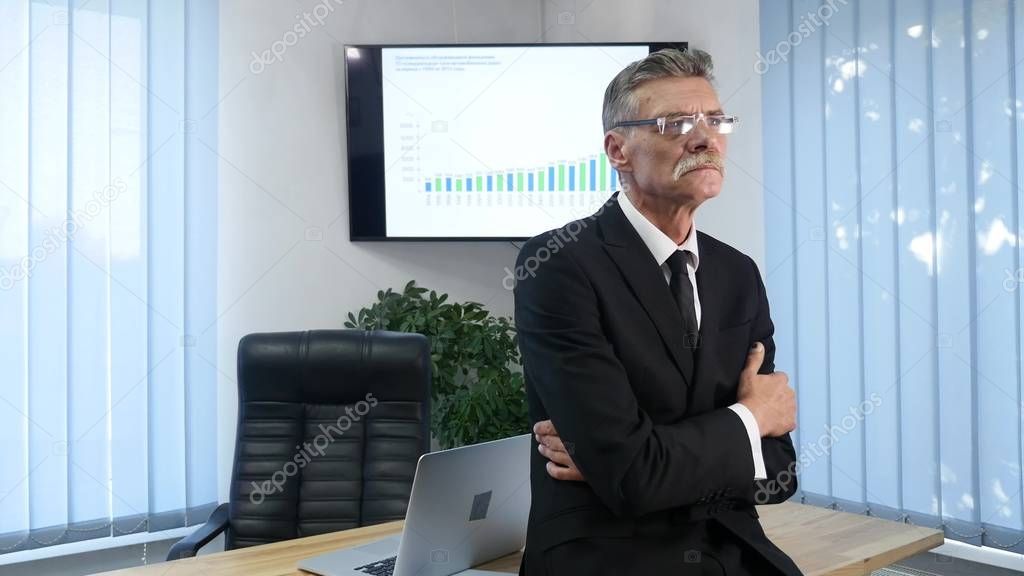 Businessman working in office in front of desktop