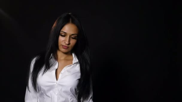 Frustrated upset young woman looking at camera isolated over black background — Stock Video