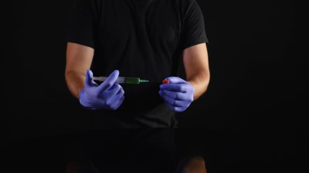 Male scientist hands with syringe injecting substance into Raspberry — Stock Video