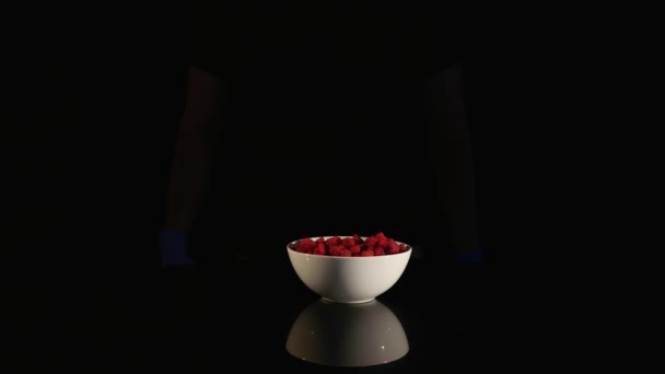 Male scientist hands with syringe injecting substance into Raspberry — Stock Video