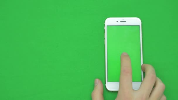 Using smart phone on green screen with various hand gestures, vertikal, close up - green screen — Stock Video