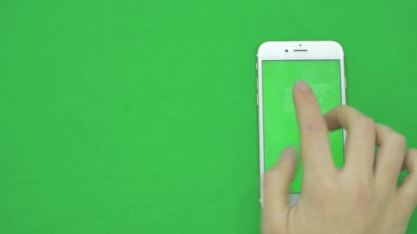 Using smart phone on green screen with various hand gestures, vertikal, close up - green screen — Stock Video