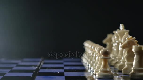 Chess boards and chess pieces game on black background — Stock Video