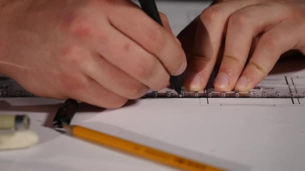 Male architect at work. Architect Hands. Ruler and a pencil in the hand of the architect. Design of the house. Engineer. Tools for drawing. Creating a drawing. Architecture — Stock Video