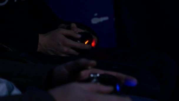 Two Man playing with a videogame controller in his hands — Stock Video