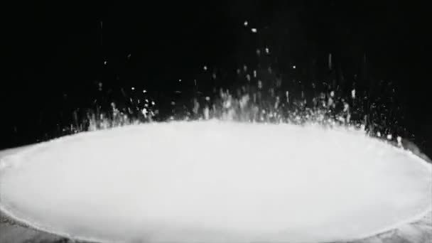 Jumping flour On Moving Subwoofer on black background — Stock Video