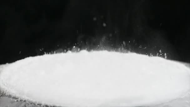 Jumping flour On Moving Subwoofer on black background — Stock Video