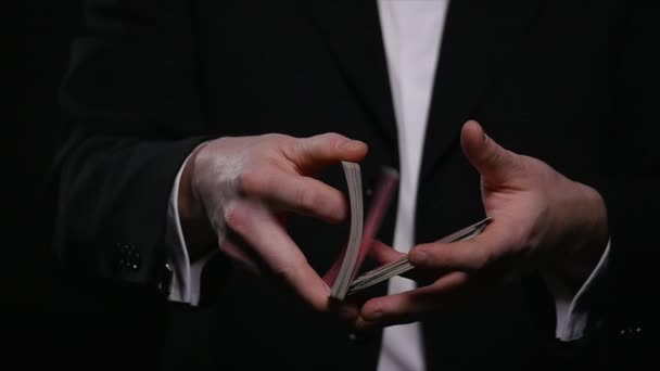 Magic, card tricks, gambling, casino, poker concept - man showing trick with playing cards — Stock Video