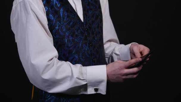 Magician is holding a burning purse in his hand — Stock Video