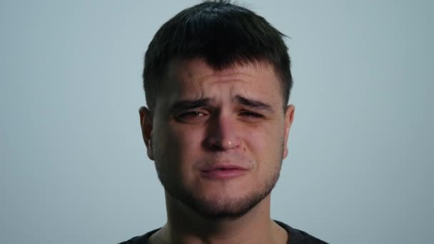 Upset Sad Young Man on White Background — Stock Video