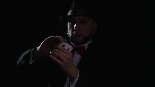 Magic, card tricks, gambling, casino, poker concept - man showing trick with playing cards — Stock Video