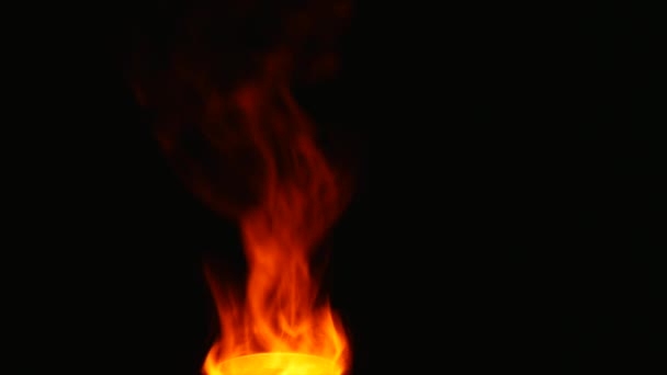 Red smoke flame on isolated black background — Stock Video