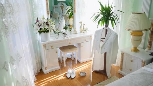 White Grooms jacket on hanger in room — Stock Video