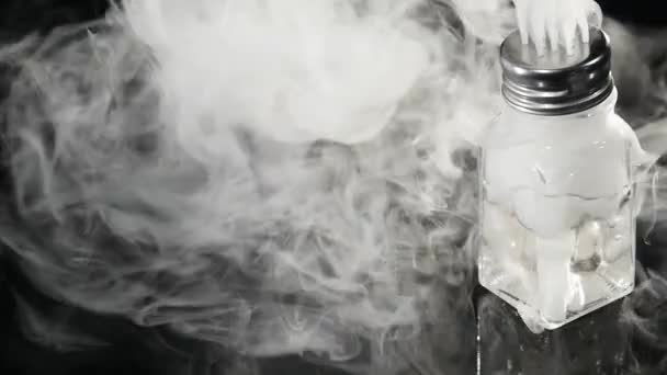 Abstract white smoke in glass the effect from dry ice on dark background — Stock Video