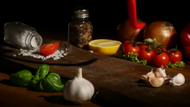 Hand puts hot pepper on a board — Stock Video