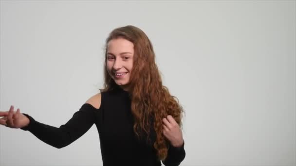 Beautiful redhead girl showing different emotions on white background — Stock Video