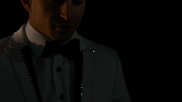 Violinist man playing the violin on a black background. Close up — Stock Video