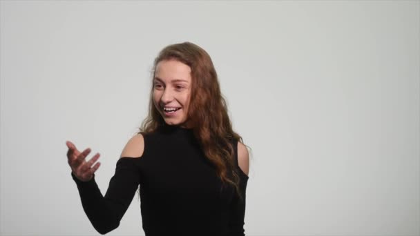 Beautiful redhead girl showing different emotions on white background — Stock Video