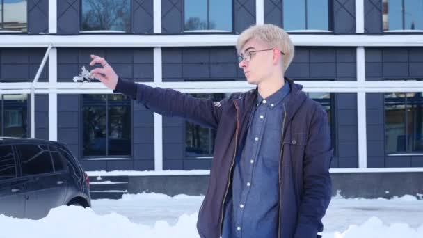 Portrait of a handsome young man holding the keys of your home — Stock Video