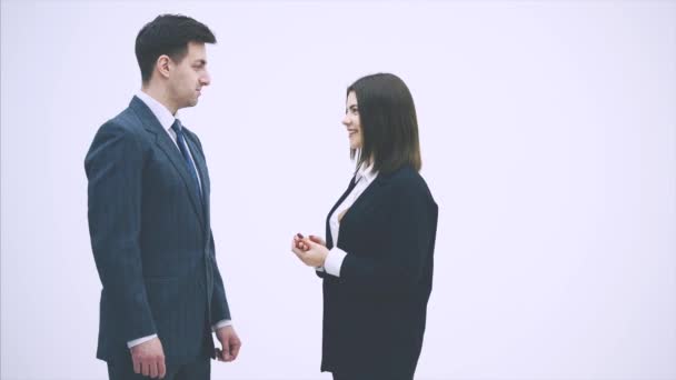 Negotiation of business partners. Man and woman in suits talking desparately, using gestures, shaking their hands. — 비디오