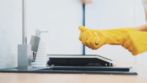 Woman is cleaning a kitchen sink with a sponge. Crop. Close up. 4K. — 비디오