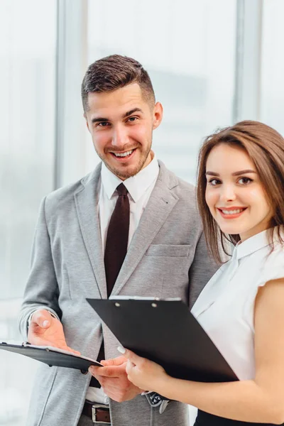 Candid shot of happy successful businesspartners wearing formal clothing and cheering, congratulating profitable deal. — Stock Photo, Image