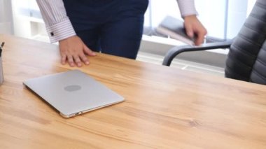 Businessmans hands type at desktop keyboard in workspace. Close up. Copy space. Crop. 4K.
