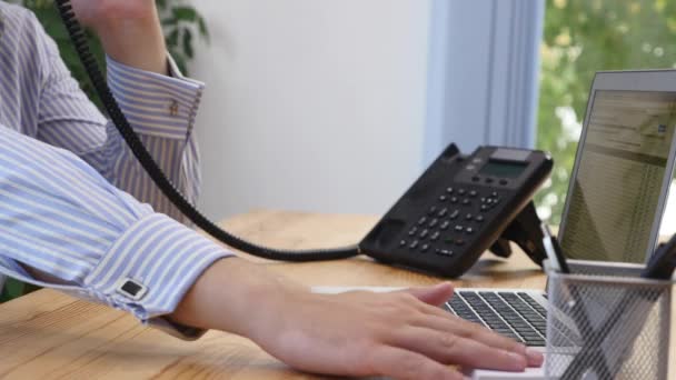 Businessmans hands type at desktop keyboard in workspace. Blurred background. Close up. Copy space. Crop. 4K. — Stockvideo