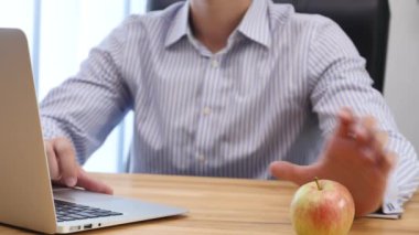 Businessmans hands type at desktop keyboard in workspace. Blurred background. Close up. Copy space. Crop. 4K.