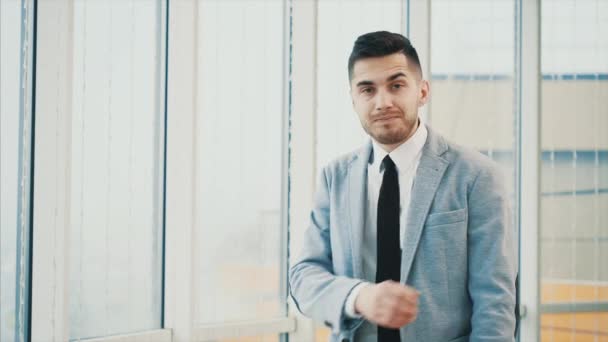 Business man is serious with his hands crossed or folded while posing, isolated on white panoramic background. Copy space. 4K. — Stok video