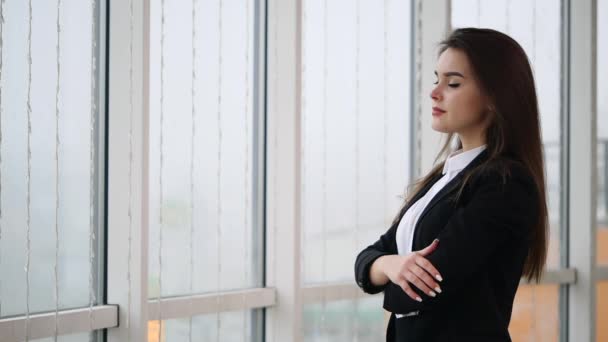 Business woman is smiling, isolated on white panoramic background. Slow motion. Close up. Copy space. 4K. — Wideo stockowe