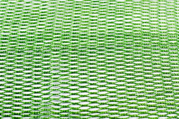 Latar belakang hijau abstrak dari kain sintetis dalam bayangan hitam . — Stok Foto