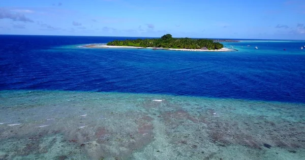 v11462 maldives white sand beach tropical islands with drone aerial flying birds eye view with aqua blue sea water and sunny sky