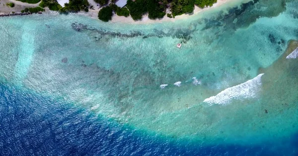 v11433 maldives white sand beach tropical islands with drone aerial flying birds eye view with aqua blue sea water and sunny sky