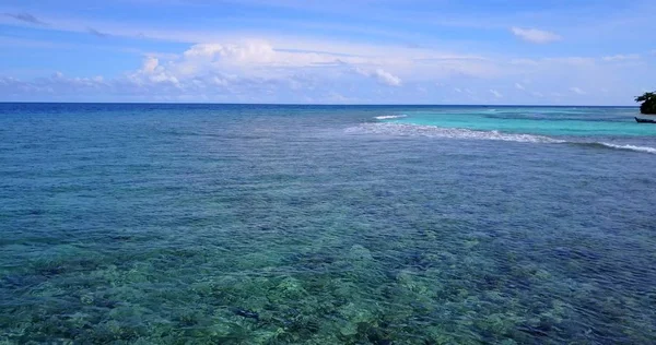 v12409 maldives white sand beach tropical islands with drone aerial flying birds eye view with aqua blue sea water and sunny sky