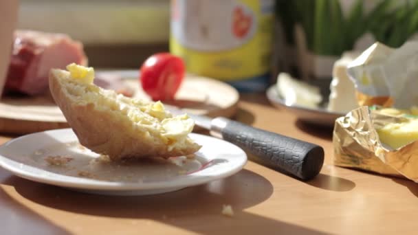 Woman hands spreading butter on bread, super slow motion — Stockvideo