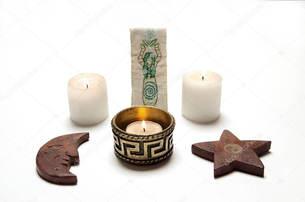 Wiccan altar, candles, pentacle and