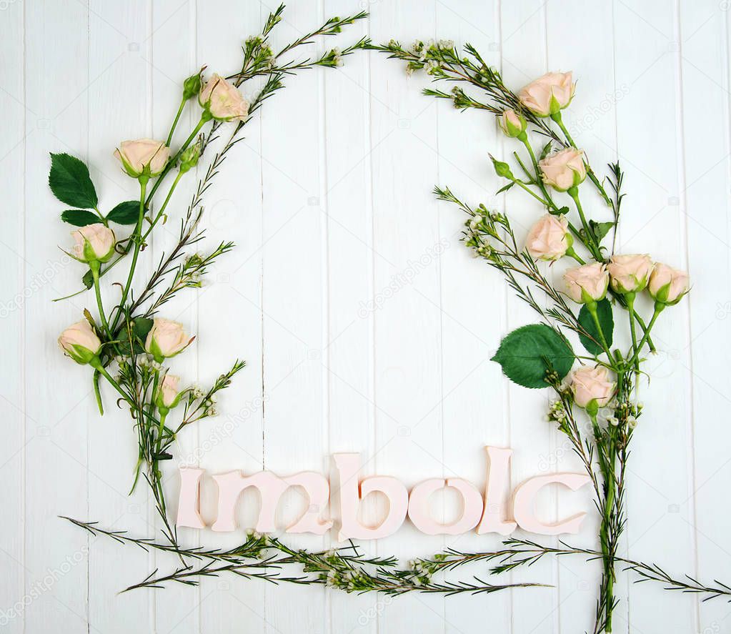 A frame made of flowers and Imbolc word