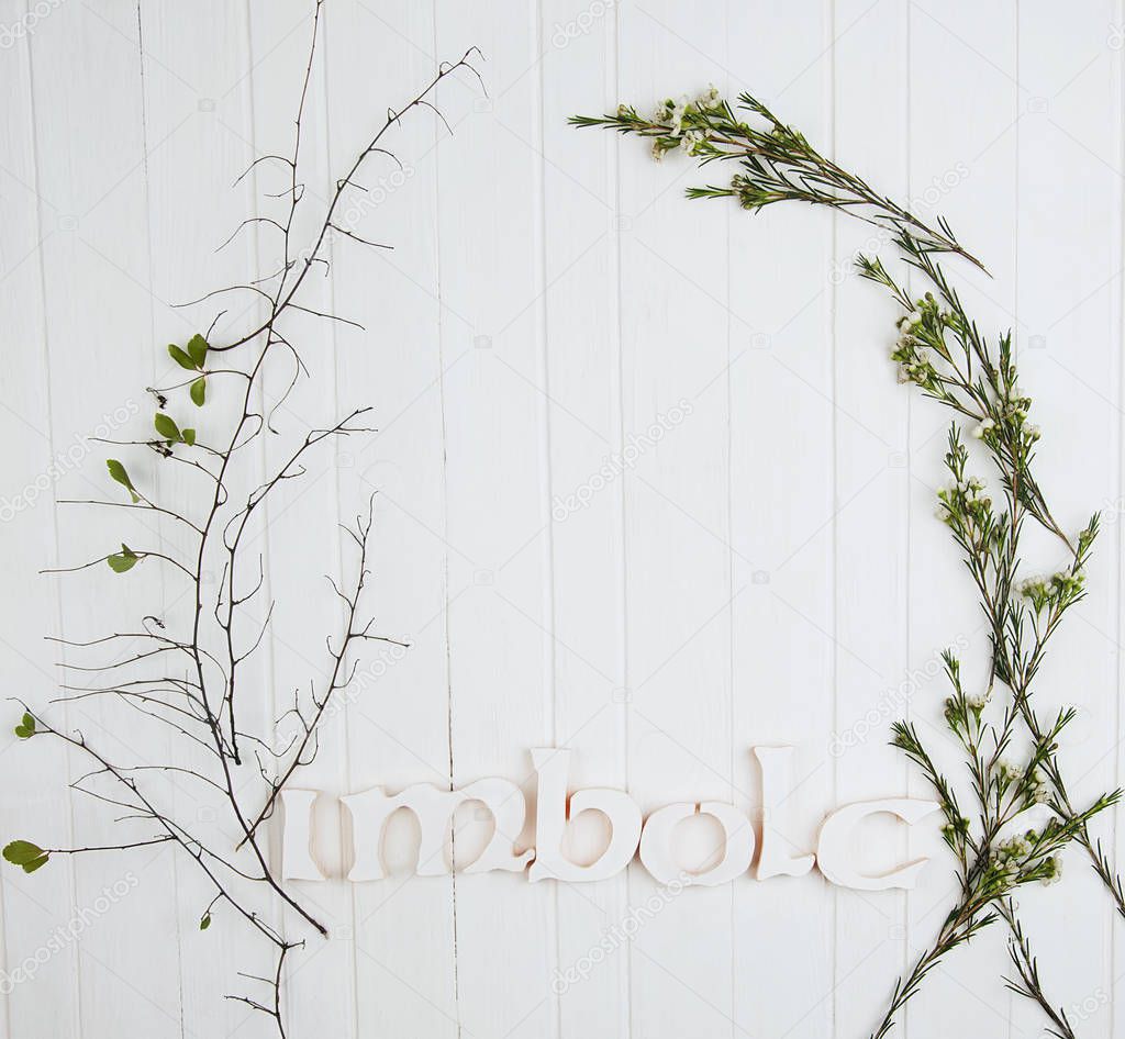 A frame made of flowers and Imbolc word